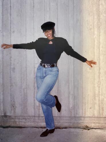 Ebonnie Rowe in jeans and sweater