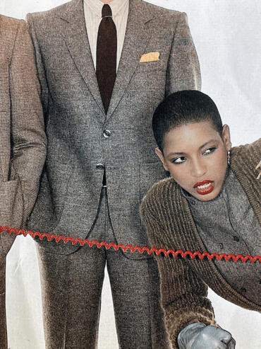 Fashion-forward individuals in tailored suits and statement accessories pose stylishly.