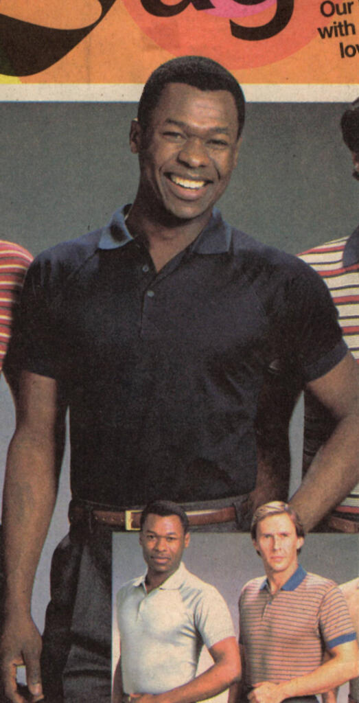 Group of diverse men, smiling and posing, dressed casually.