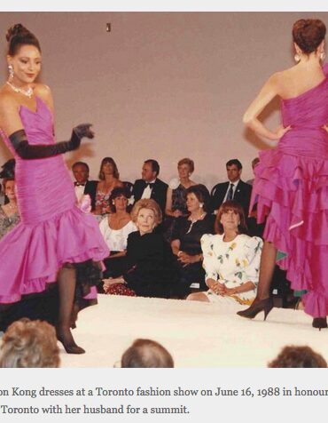 Two women in vibrant purple ruffled dresses perform at Toronto fashion show, 1988.