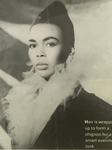 Elegant woman with hair styled into a chic chignon for an evening look