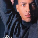 Close-up of Gary Archibald, a model managed by Elite, with striking eyes and smooth skin, dressed in a dark turtleneck, highlighting high fashion elegance.