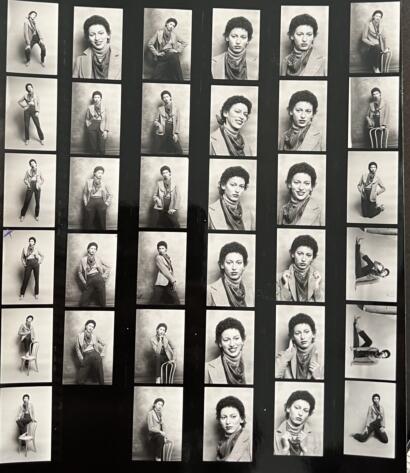 Black-and-white portrait contact sheet of a woman in various stylish poses and expressions.