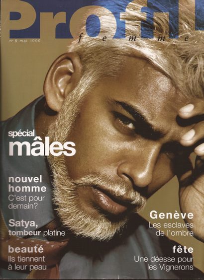 Close-up of a mature man with platinum blonde hair and beard, featured on the cover of a 1999 fashion magazine.
