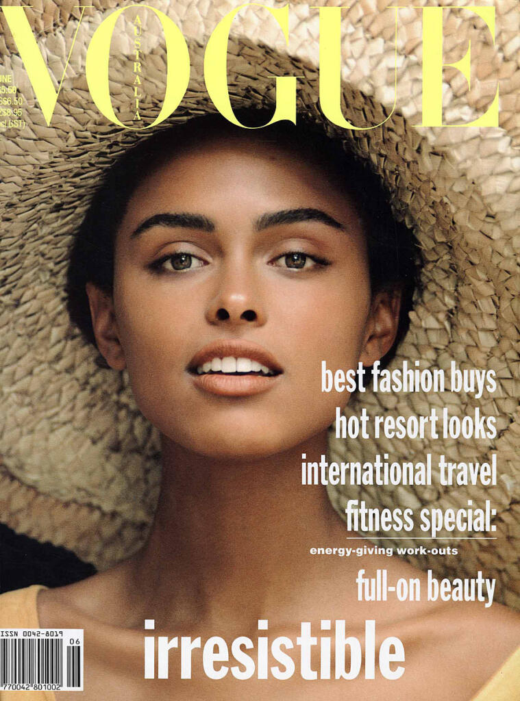 Vogue Australia cover featuring a woman wearing a wide-brimmed straw hat, with headlines about fashion, travel, fitness, and beauty.