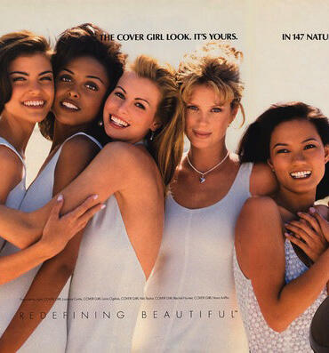 Group of diverse women smiling, celebrating natural beauty together.