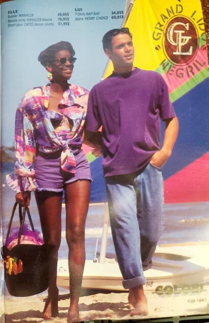 Casual beachwear: a woman in colorful blouse and shorts, and a man in relaxed denim and purple t-shirt.