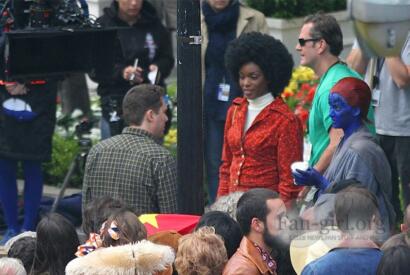 On the set of "Black Panther," cast members and crew gather outdoors during filming.
