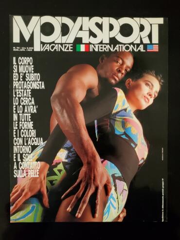 Fashion magazine cover featuring two models in colorful athleticwear, posing together.