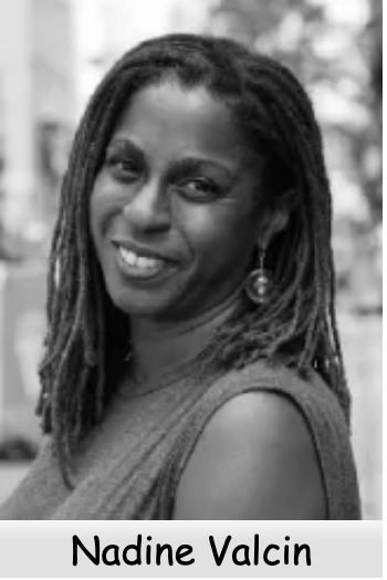 Portrait of Nadine Valcin with dreadlocks, smiling in an outdoor setting.