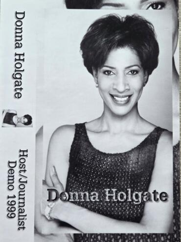 Black and white promotional image of Donna Holgate, a fashion stylist, smiling with crossed arms.