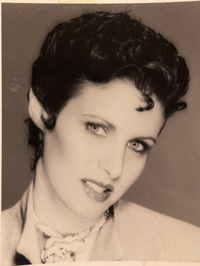 Black and white portrait of a woman with a vintage hairstyle