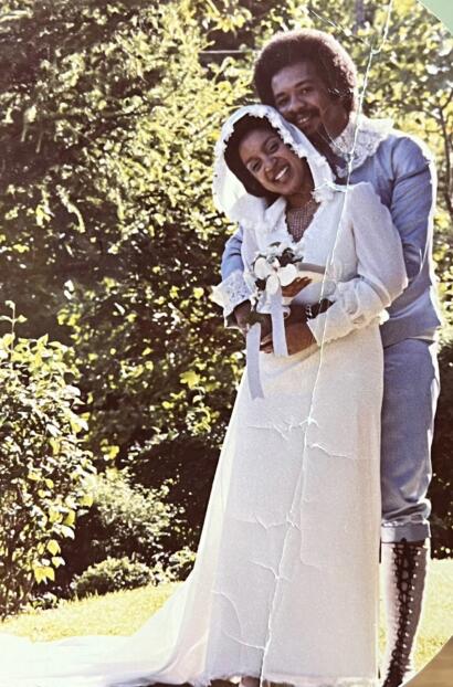 Vintage wedding photo of a couple outdoors on their special day.