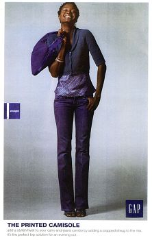 Woman in stylish purple and navy outfit, smiling confidently, GAP fashion.