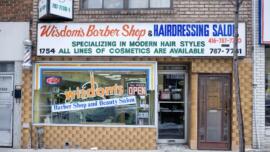 Exterior view of Wisdom's Barber Shop and Beauty Salon on Eglinton West.