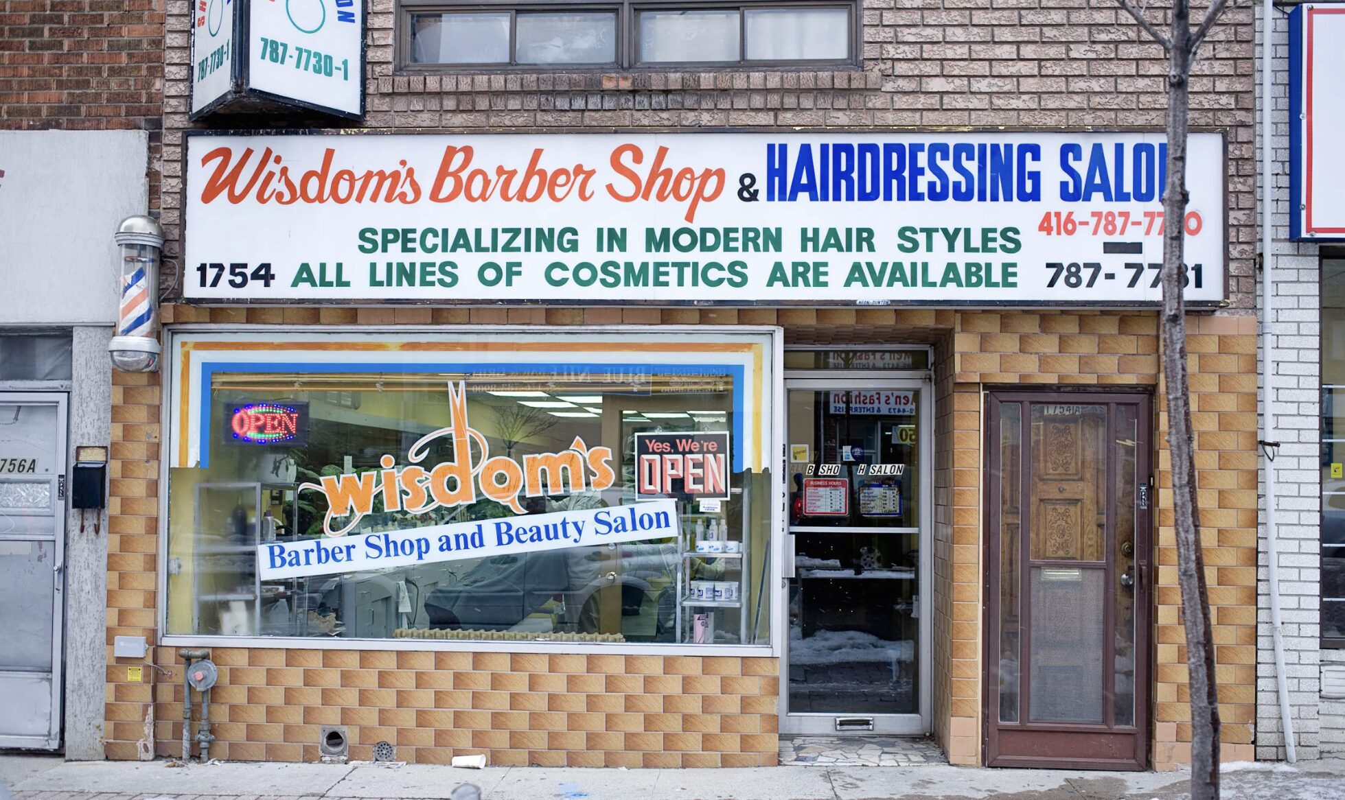 Exterior view of Wisdom's Barber Shop and Beauty Salon on Eglinton West.